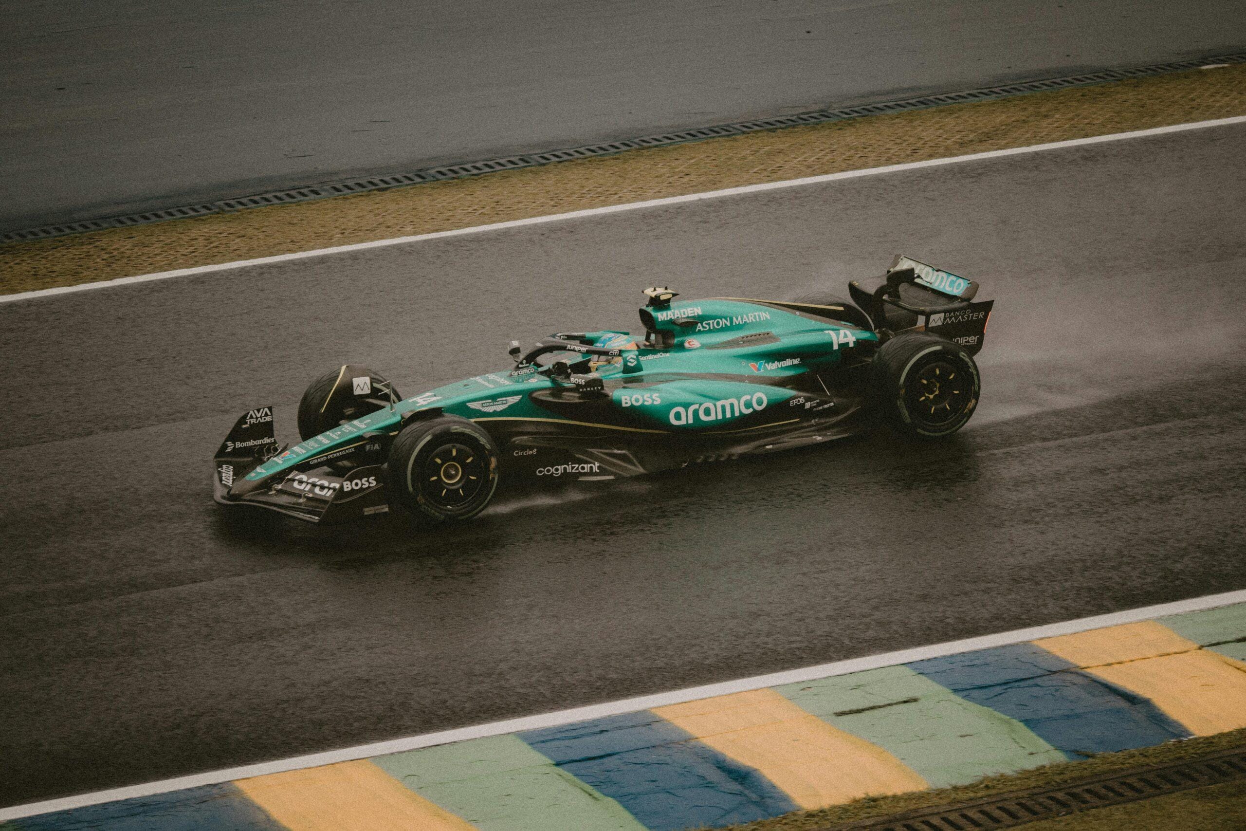 A dynamic shot of a red Formula 1 car speeding on the race track, showcasing racing energy.